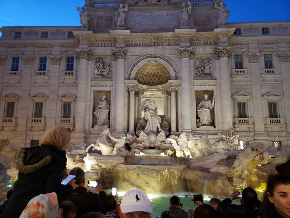 Tossed coins into Trevi Fountain in Rome